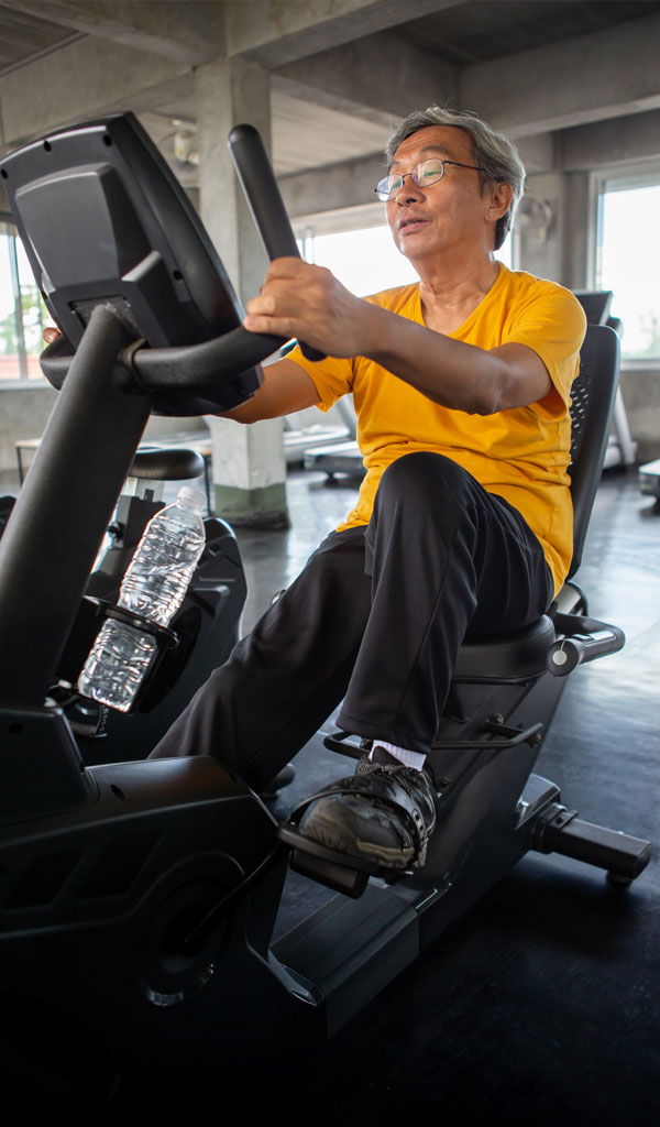 Our-commitment-male-working-out Man exercising with fitness equipment in Dayton Ohio